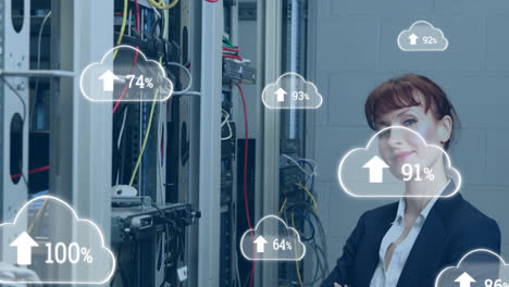Animation-of-clouds-with-increasing-numbers-over-smiling-caucasian-woman-standing-at-servers