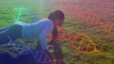 Animation-of-dna-strands-over-biracial-woman-exercising-in-park