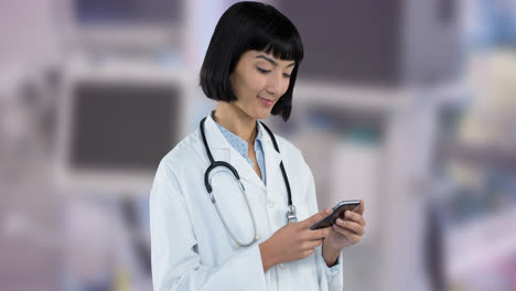 Animation-of-smiling-caucasian-female-doctor-using-smartphone-over-blue-ribbon