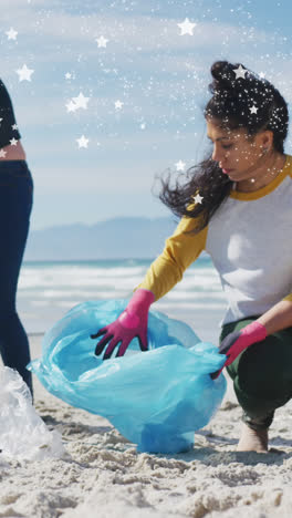 Animation-of-stars-over-diverse-female-and-male-volunteers-picking-up-rubbish-on-beach