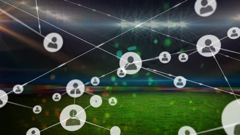 Animation-of-network-of-connections-with-icons-over-sports-stadium