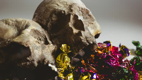 Skulls-and-sweets-lying-in-brown-background