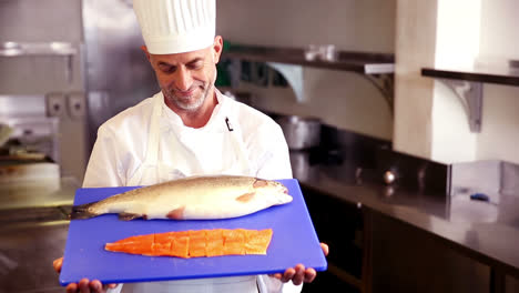 Chef-showing-fillet-of-salmon
