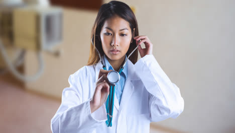 Animation-of-asian-female-doctor-with-stethoscope-over-surgeon-room