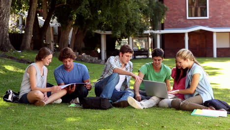 Classmates-sitting-on-the-grass-chatting-