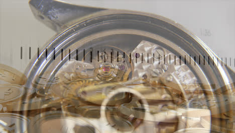 Financial-data-processing-over-close-up-of-a-watch-and-yen-gold-coins-against-grey-background