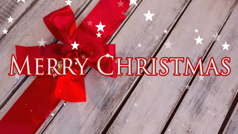 Animation-of-merry-christmas-text-over-red-ribbon-and-stars-falling