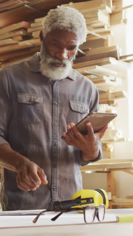 African-American-man-in-a-woodworking-workshop,-with-copy-space