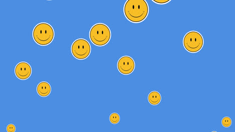 Animation-of-falling-emojis-over-blue-background