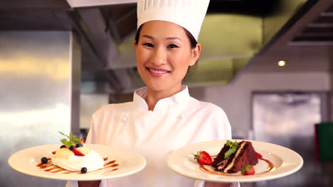 Happy-chef-showing-two-dessert-plates