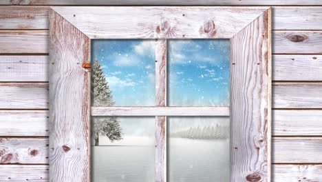 Wooden-window-frame-against-snow-falling-over-christmas-tree-on-winter-landscape