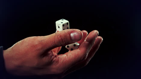 Animation-of-dice-on-hand-over-black-background