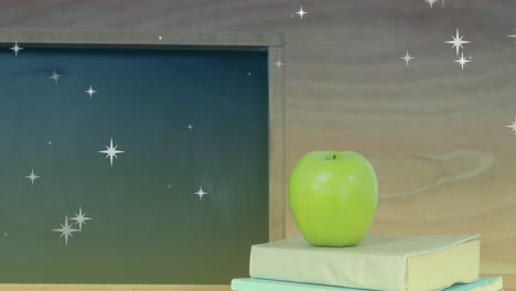 Animation-Von-Sternen-über-Apfel-Mit-Büchern-Und-Brett