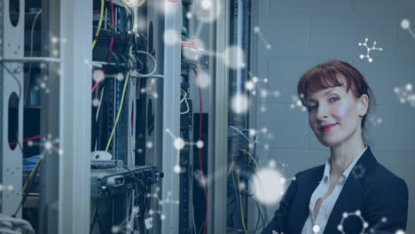 Animation-of-molecules-over-smiling-caucasian-woman-standing-at-servers