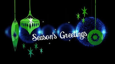 Animation-of-christmas-greetings-over-christmas-green-and-blue-baubles-decorations-in-background