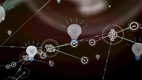 Animation-of-network-of-connections-with-globe-icons-over-bulbs-on-brown-background