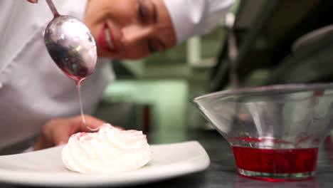 Happy-chef-pouring-syrup-over-meringue