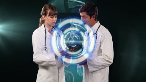 Animation-of-data-processing-over-caucasian-male-and-female-doctors-talking