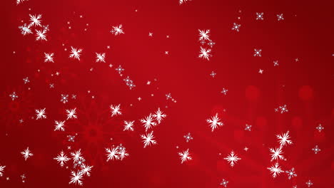 Animation-of-snowflakes-floating-and-falling-against-red-background-with-copy-space