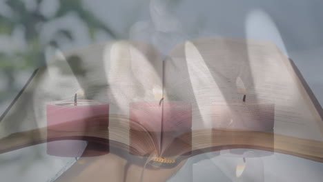 Composite-Video-Von-Brennenden-Kerzen-über-Frauenhänden-Mit-Rosenkranzgebet-Vor-Offener-Bibel
