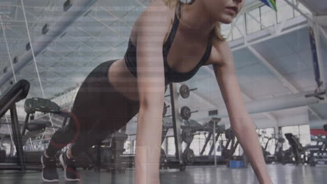 Animation-of-statistical-data-processing-over-caucasian-fit-woman-performing-push-ups-at-the-gym