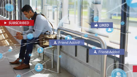 Animation-of-digital-and-social-media-icons-against-biracial-man-using-smartphone-at-bus-stand