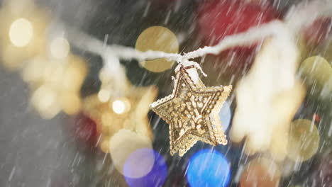 Video-of-christmas-decorations-with-copy-space-and-snow-falling-in-background