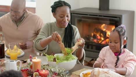 African-american-parents,-children-and-grandparents-celebrating-at-thanksgiving-dinner,-slow-motion