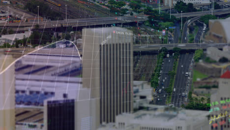 Animation-of-statistical,-stock-market-data-processing-over-aerial-view-of-timelapse-of-city-traffic