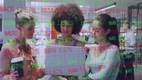 Animation-of-stock-market-data-processing-over-three-diverse-women-discussing-over-laptop-at-office