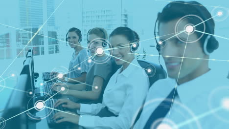 Animation-of-network-of-connections-over-diverse-colleagues-wearing-phone-headsets-smiling-at-office