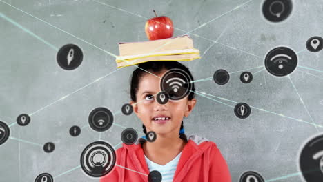Animation-of-network-of-icons-over-biracial-girl-balancing-books-and-apple-on-her-head-at-school