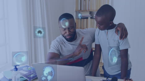 Animation-of-data-processing-over-african-american-father-and-son-using-laptop-discussing-at-home