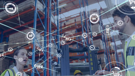 Animation-of-network-of-connections-with-icons-over-man-and-woman-working-in-warehouse