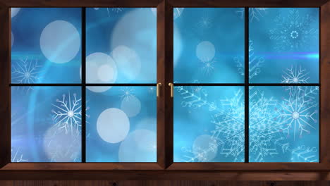 Animation-of-window-over-snow-and-light-spots-on-blue-background