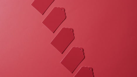 Video-of-red-price-tags-with-copy-space-on-red-background