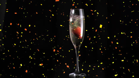 Animation-Von-Konfetti-über-Einem-Glas-Champagner
