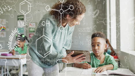Animation-of-chemical-formulas-over-diverse-female-teacher-teaching-a-boy-at-school