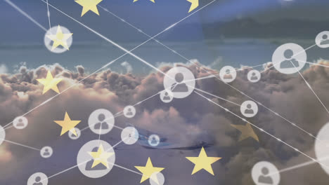 Animation-of-connected-icons-with-lines,-europe-flag-over-dense-clouds-in-background