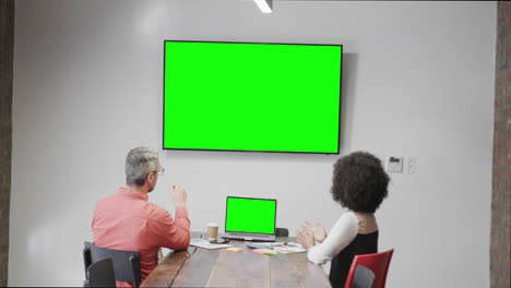 Diverse-business-people-on-video-call-with-green-screen