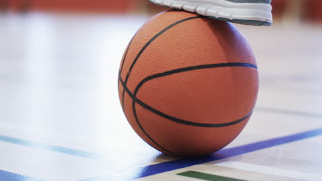 Close-up-of-a-basketball-on-the-court,-with-copy-space