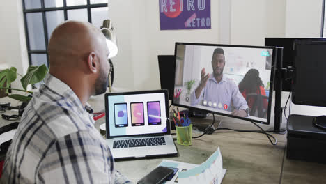 African-american-businessman-on-video-call-with-african-american-male-colleague-on-screen