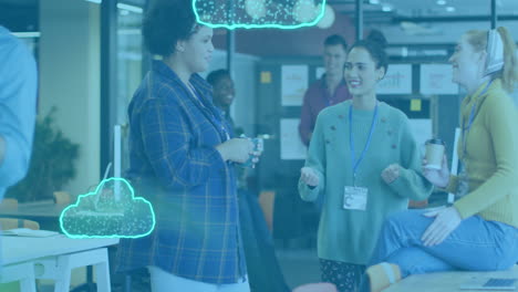 Animation-of-multiple-neon-cloud-icon-floating-against-group-of-diverse-women-discussing-at-office