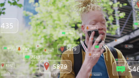 Animation-of-social-media-data-processing-over-albino-man-using-smartphone-in-city