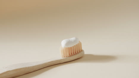 Close-up-of-toothbrush-with-toothpaste-on-white-background
