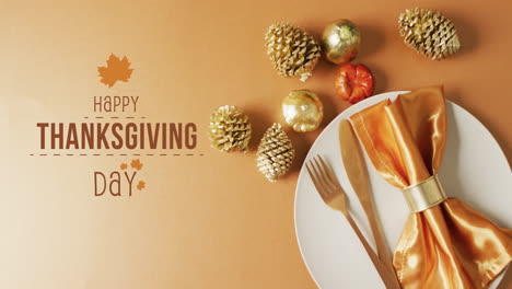 Animation-of-happy-thanksgiving-day-text-over-decorations-and-place-setting