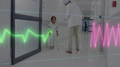 Animation-of-heart-rate-monitor-on-diverse-male-doctor-talking-to-disabled-girl-in-hospital-corridor