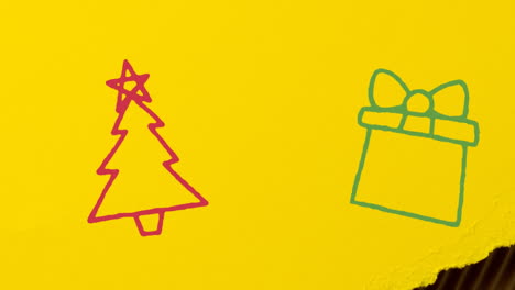 Animation-of-hand-drawing-christmas-decorations-on-yellow-paper-background
