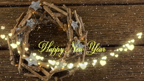 Animation-of-happy-new-year-text-in-yellow-over-heart-string-lights-and-christmas-wreath