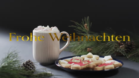 Frohe-weihnacthen-text-in-gold-over-christmas-hot-chocolate-and-cookies